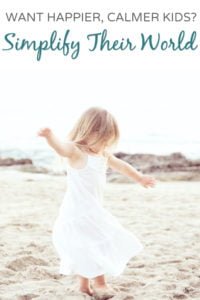 Happy preschool girl enjoying a simple day at the beach