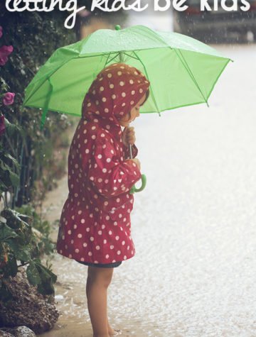 child with umbrella outside