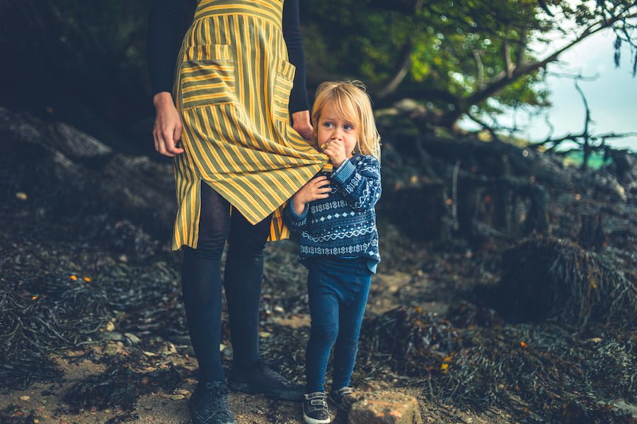 Mindful parenting mother and child by river