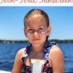 Young girl using safe sunscreen for swimming and boating