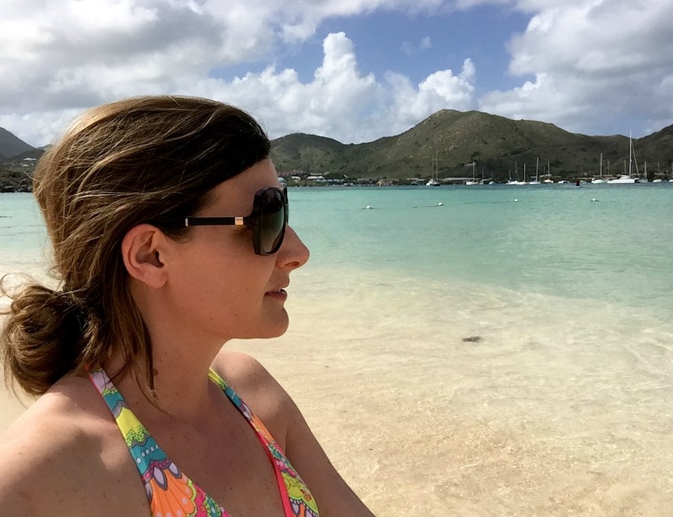 Woman at Caribbean ocean wearing nontoxic sunscreen