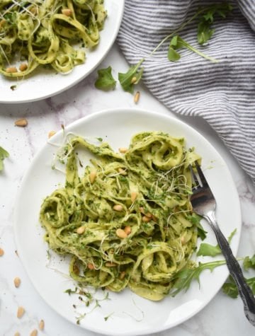 This fresh arugula pesto pasta is gluten-free, vegan, and can easily fit into your simple and healthy weeknight meal plan.