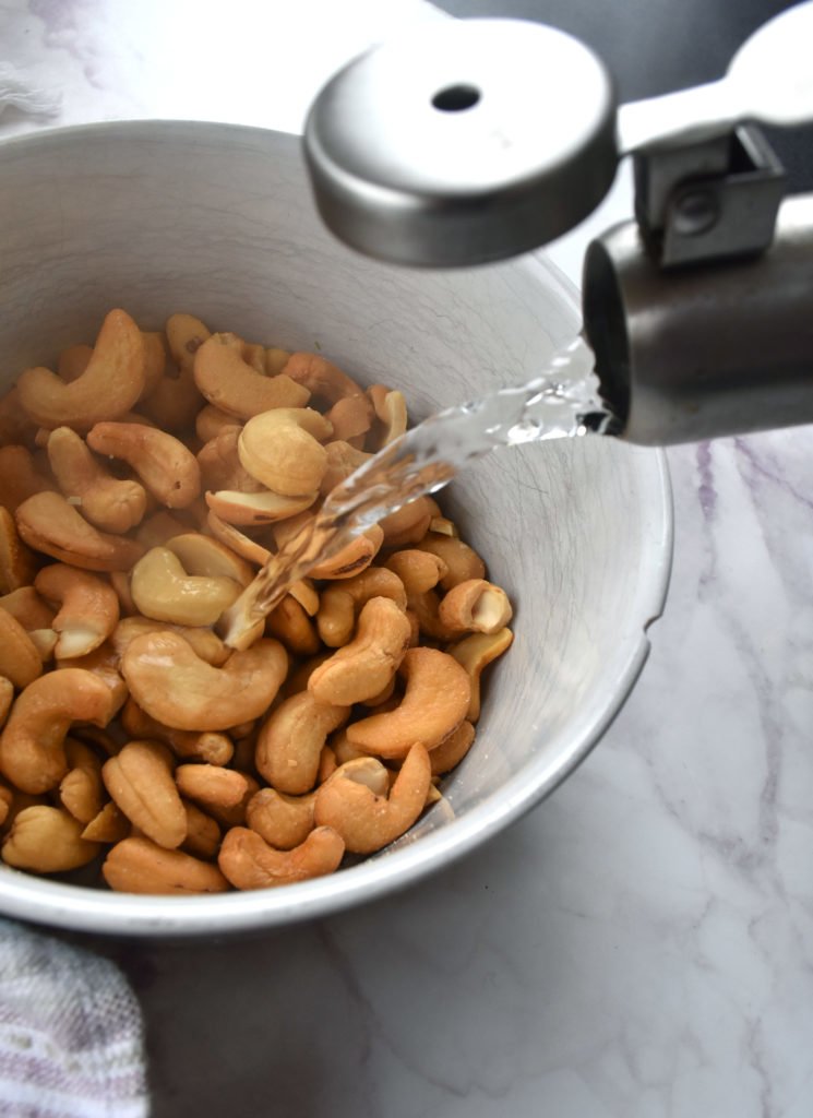 Pour boiling water on cashews and soak for one hour for Cashew Lime Bars