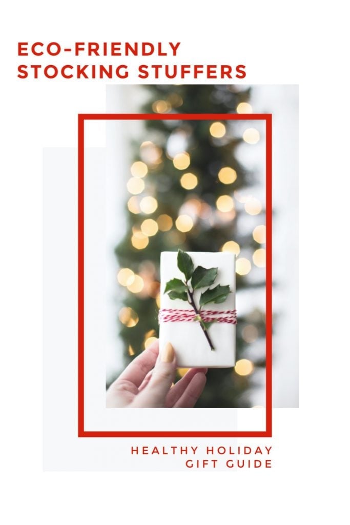 Eco-friendly stocking stuffers small holiday gift in front of Christmas tree with white lights 