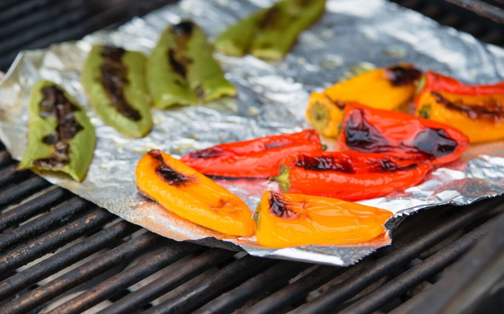 grilled peppers on aluminum foil