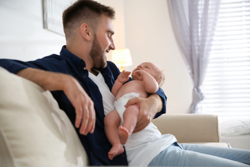 dad bonding with newborn