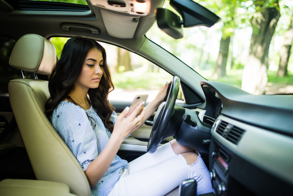 teen girl texting while driving risk behavior