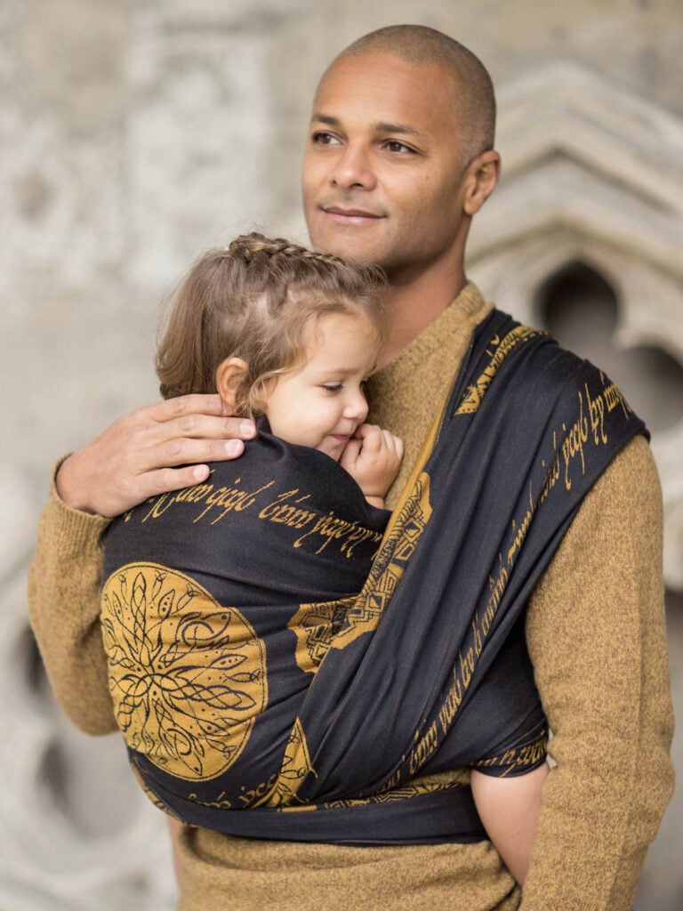 father and baby in rings of power sling