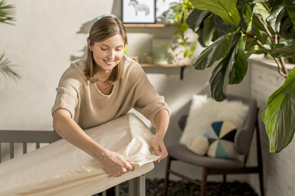 covering crib mattress with protector pad