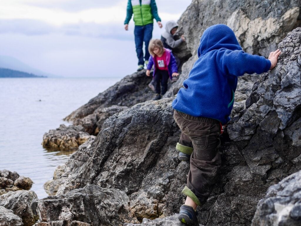 kids climbing in nature
